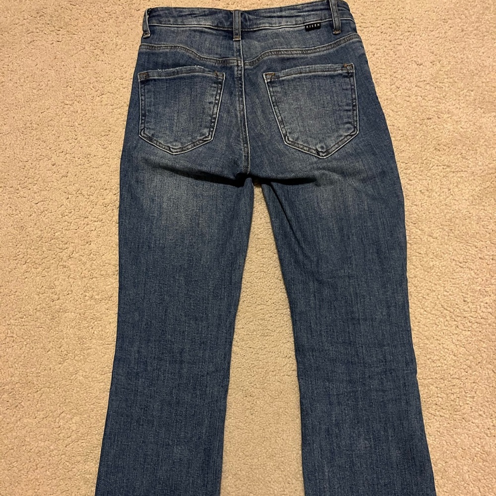 Risen slightly distressed frayed hem straight leg jeans